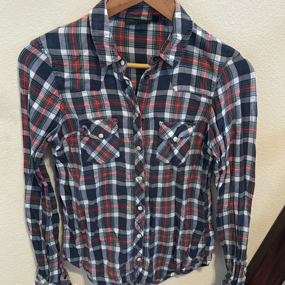 Woman’s Topshop S long sleeve light flannel snap shirt.